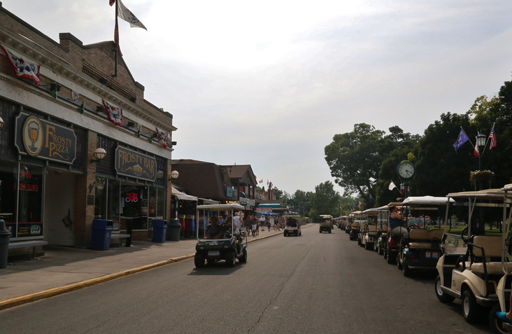 Tourist riding golf carts at Put-In-Bay Village, South Bass Island, Ohio, USA