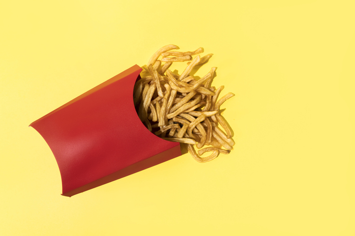 French Fries On Yellow Background