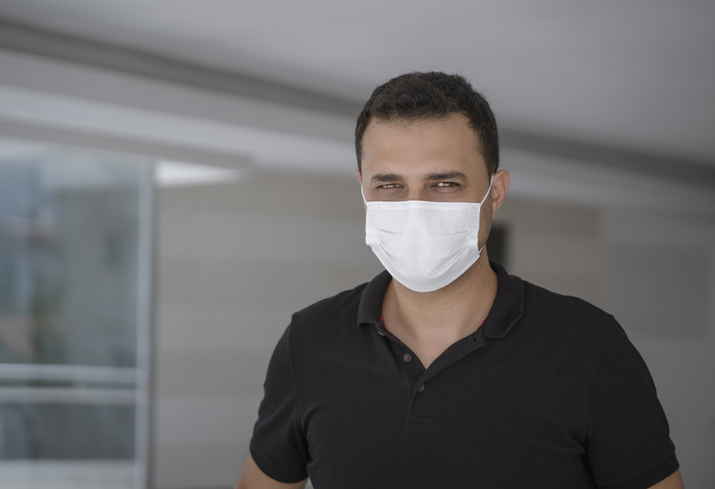 Portrait of a mature man with protective face mask in the office