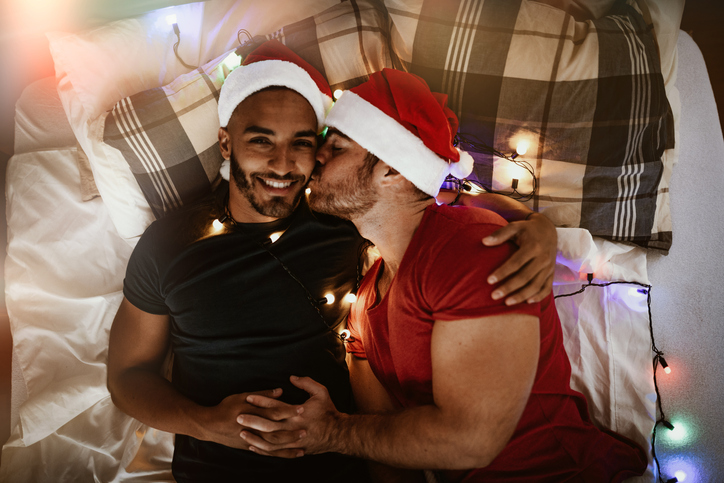 Diverse LGBT - gay couple celebrating Christmas - intimacy and romance
