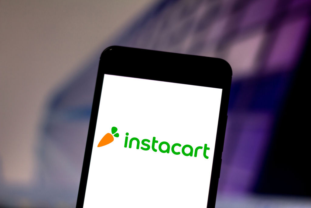 In this photo illustration the Instacart logo is seen...