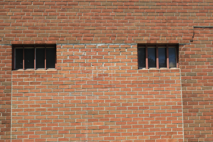 Exterior building with windows that have security bars for protection