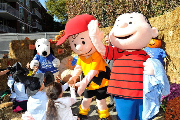 Justin Tuck And Snoopy Read "It's The Great Pumpkin, Charlie Brown"