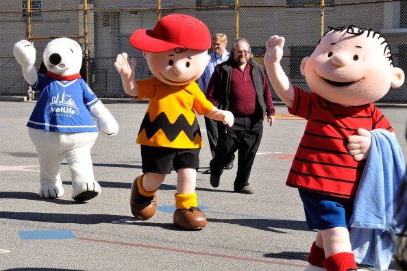 Justin Tuck And Snoopy Read "It's The Great Pumpkin, Charlie Brown"