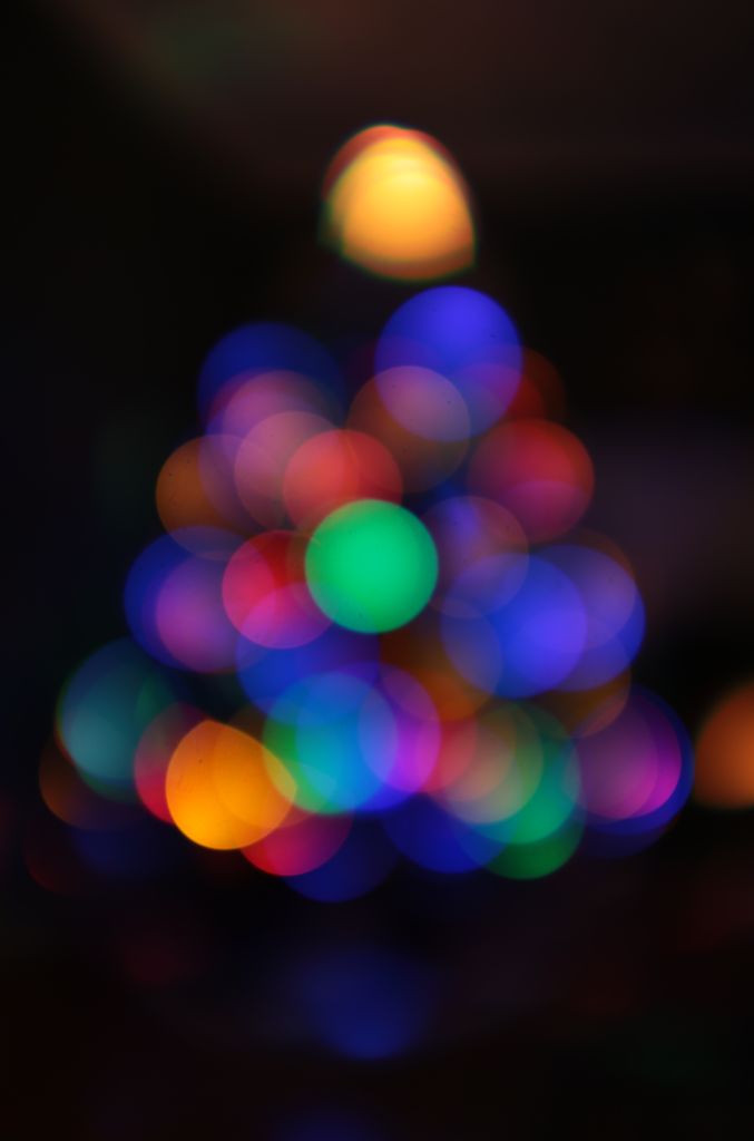 Defocused Christmas Tree with lighted orbs