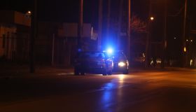 Police vehicle stop a speeding motorist on a dark road