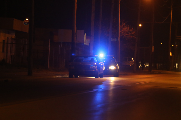 Police vehicle stop a speeding motorist on a dark road