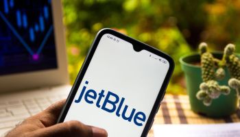 In this photo illustration the JetBlue Airways logo seen...
