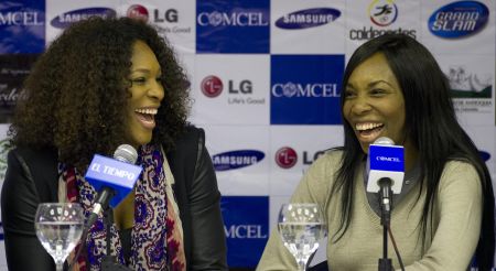 Serena and Venus laugh during a press conference in Bogota