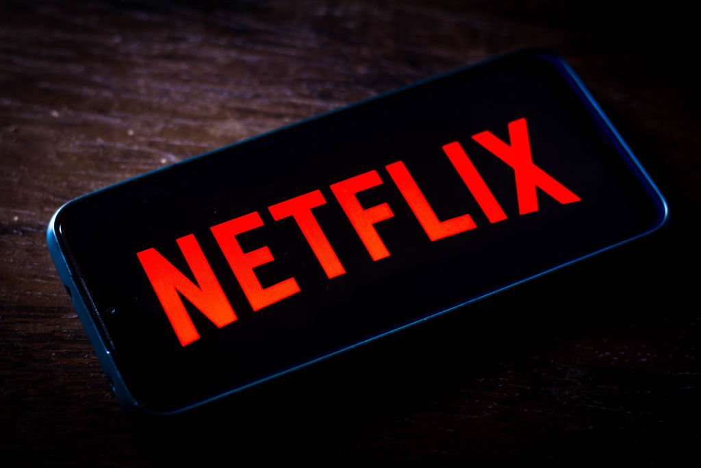 In this photo illustration the Netflix logo seen displayed...