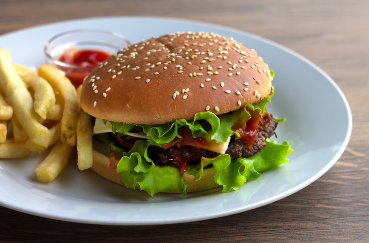 Burger with French fries and barbecue sauce