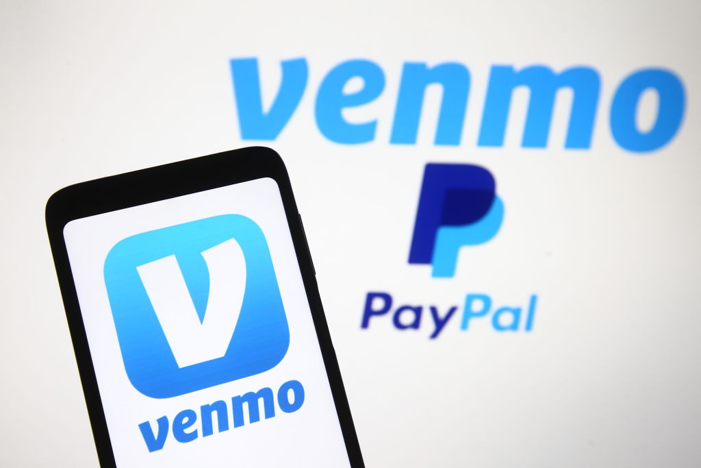 In this photo illustration, Venmo logo, a mobile payment...