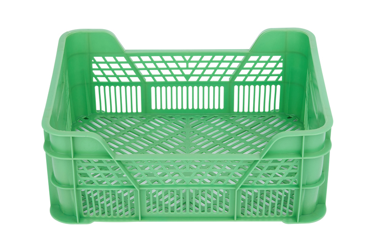 Green plastic crate isolated on white background