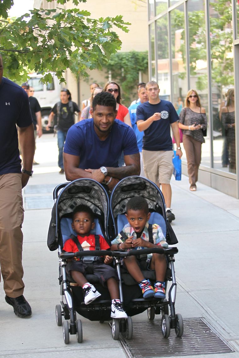 Usher Raymond pushes his sons, Usher Raymond V and Naviyd Raymond