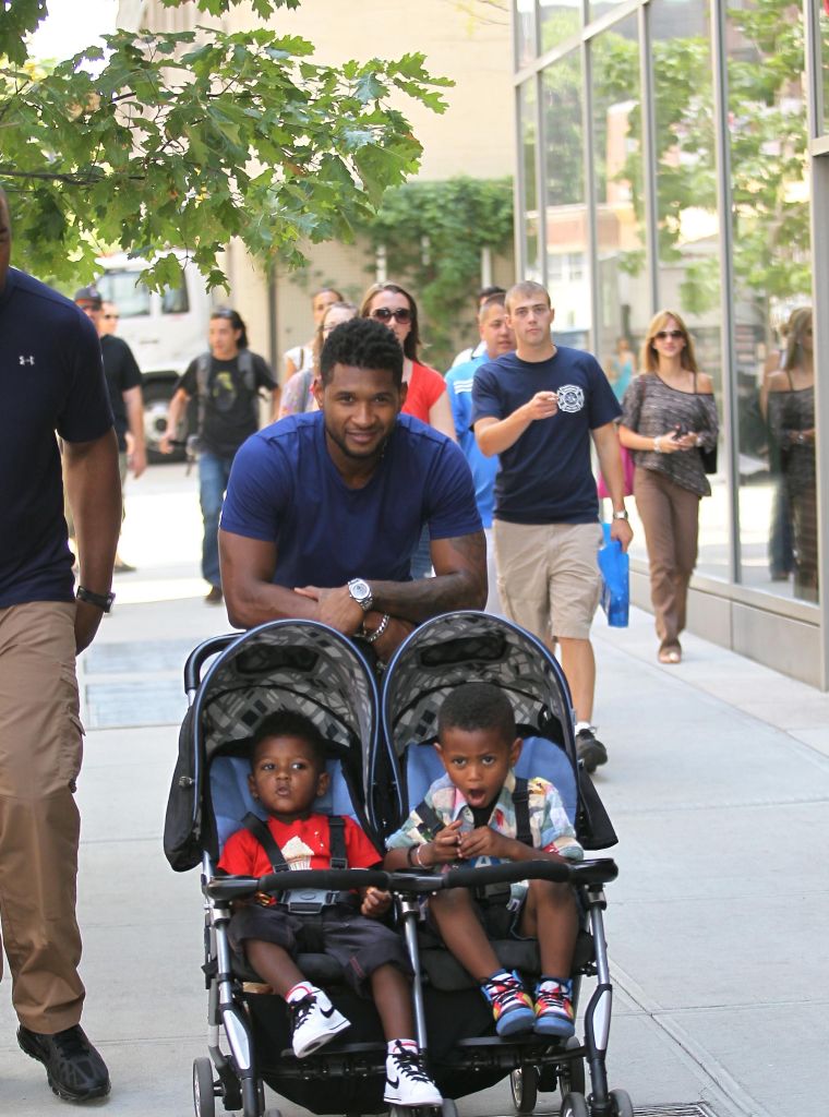 Usher Raymond pushes his sons, Usher Raymond V and Naviyd Raymond