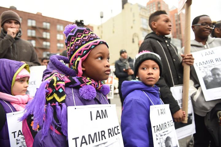 Kids with Tamir Rice signs. Stop Mass Incarcerations Network...
