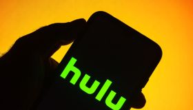 In this photo illustration the Hulu logo seen displayed on a...