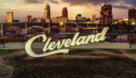 Cleveland script sign and city skyline in the evening - Tremont