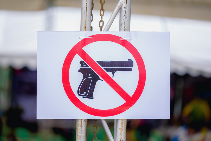 Close-Up Of Gun Free Zone Sign