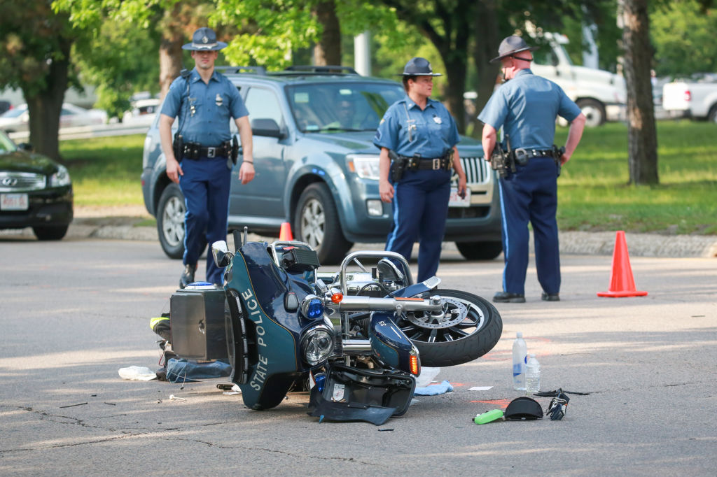 (Medford, MA 05/27/16) A Massachusetts State Trooper is injured after being involved in a motorcycle accident outside the Medford barracks in Wellington Circle in Medford on Friday, May 27, 2016. Staff photo by Nicolaus Czarnecki