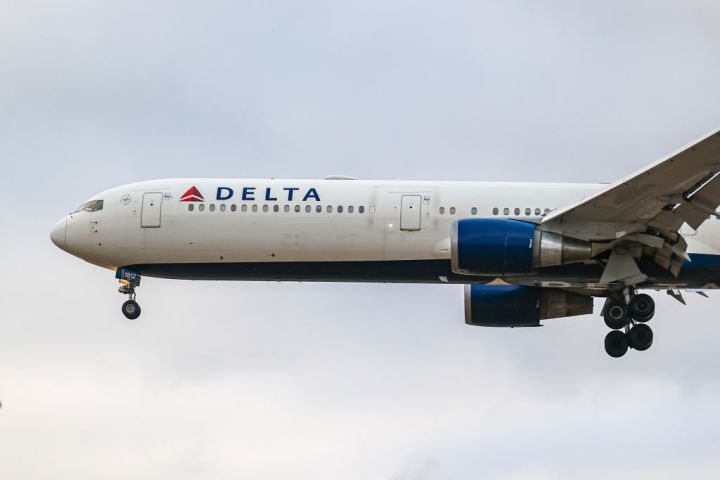 Delta Air Lines wide-body Boeing 767-400 airplane with tail...