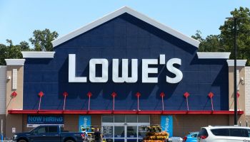 The Lowe's logo is displayed on the front of the store near...