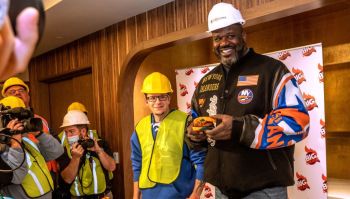 Shaquille O'Neal hold sandwich that will be served at his restaurant at UBS Arena in Elmont, New York