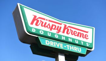 Krispy Kreme Doughnuts store sign on building exterior, store frontage