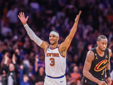 New York Knicks Josh Hart raises his arms during game