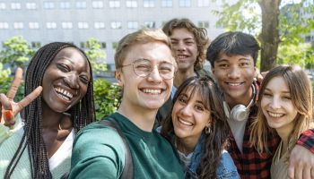 Multicultural Teenagers Taking a Selfie at School Park