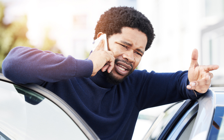 Phone call, vehicle breakdown and a frustrated black man talking to roadside assistance with an issue or problem. Car, insurance and travel with a male client speaking on his mobile in the city