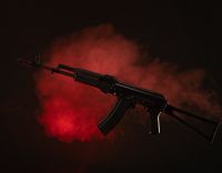 kalashnikov assault rifle in smoke