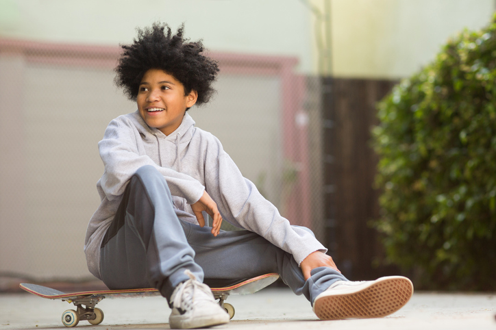 Young mixed race teenage boy looking at the camera.