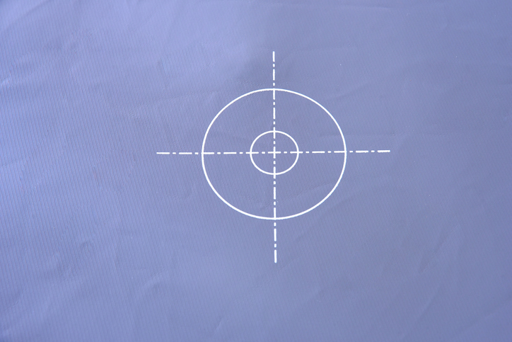 target sights on gray card white circle