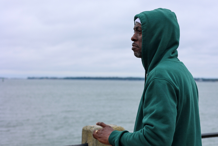 A portrait of a black man sad