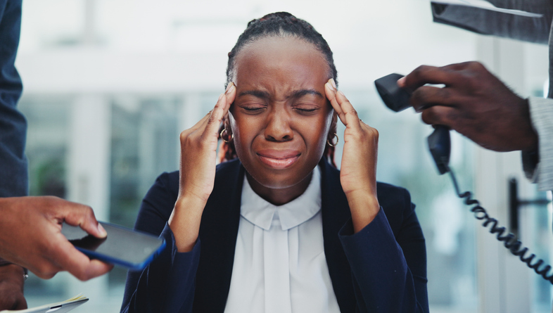 Business, woman or headache with stress for multitasking in office with phone call, overworked or pressure. African employee, accountability or frustrated with time management, mental health or hands