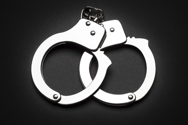 Crime law arrest police steel handcuffs isolated