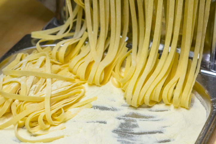 The chef makes fresh spaghetti from scratch