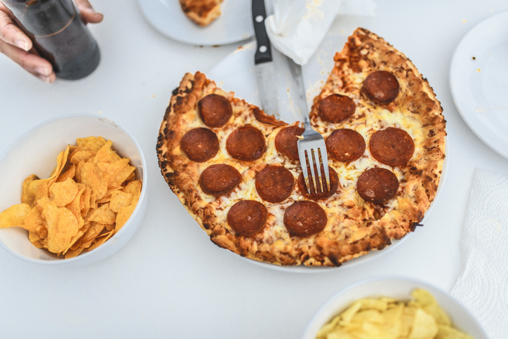 Close-up of pizza topped with salami slices