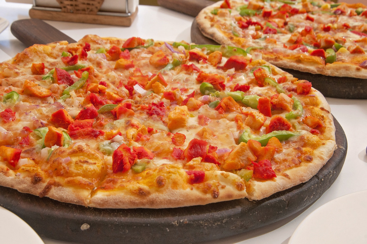 Close-Up Of Pizza Served On Table