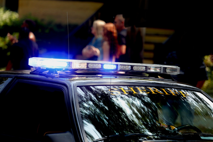 Sheriff’s vehicle with flashing siren