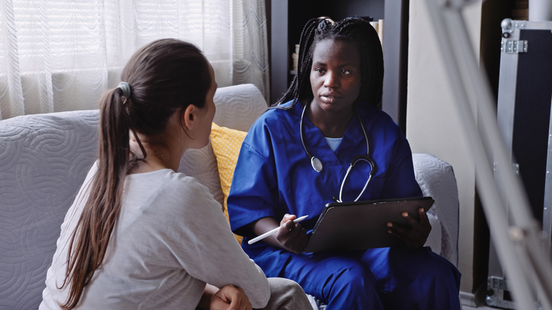 Home visit from GP for medical exam. Home caregiver.