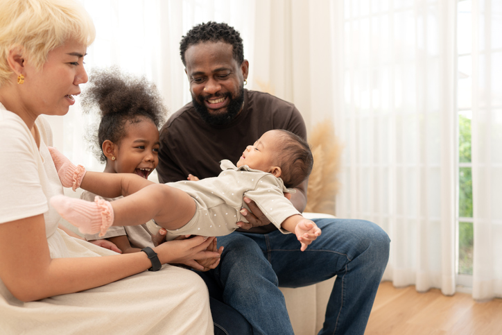 Parents and children relax during their holiday at home