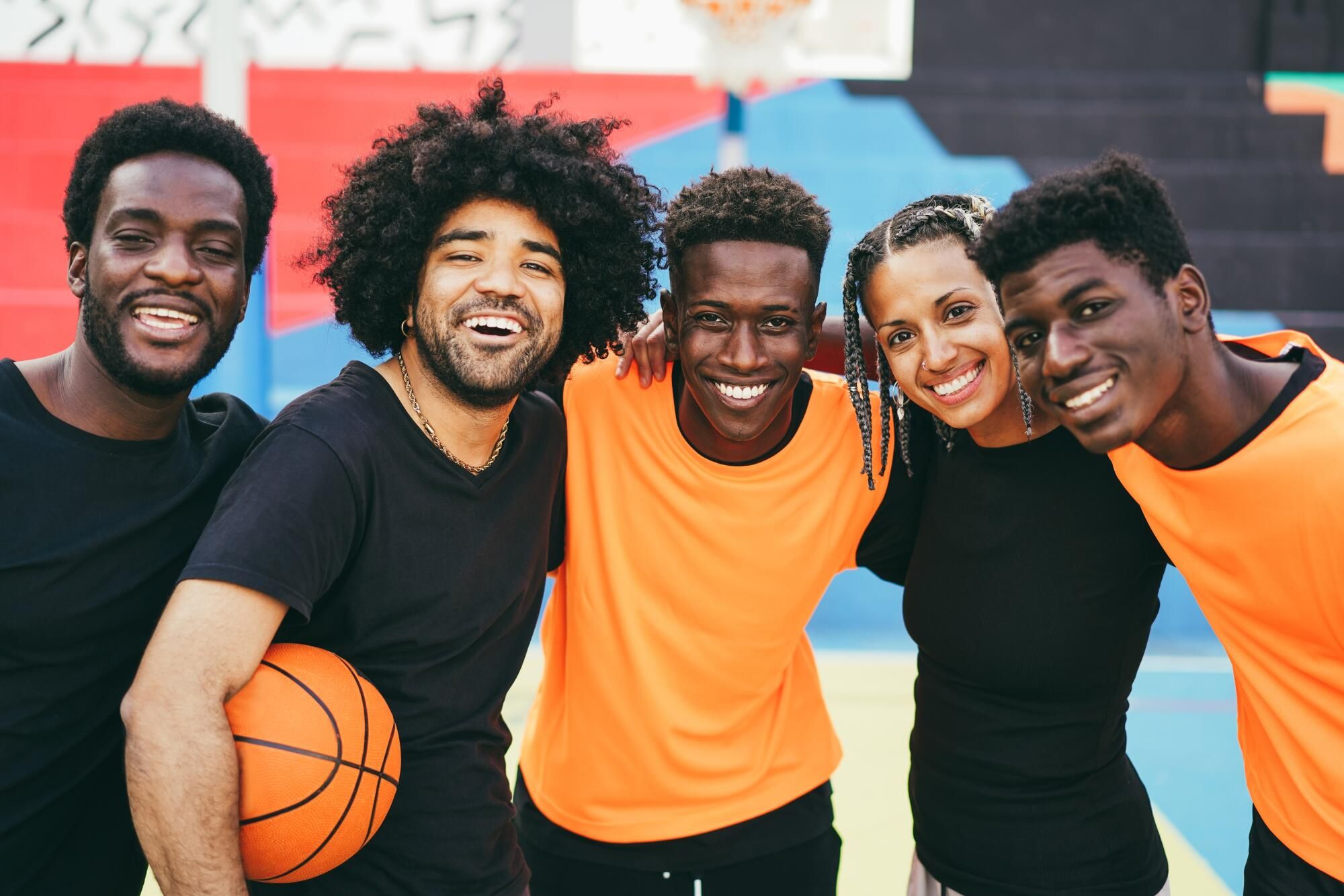 Who are the support teams needed for top athletes to achieve success?